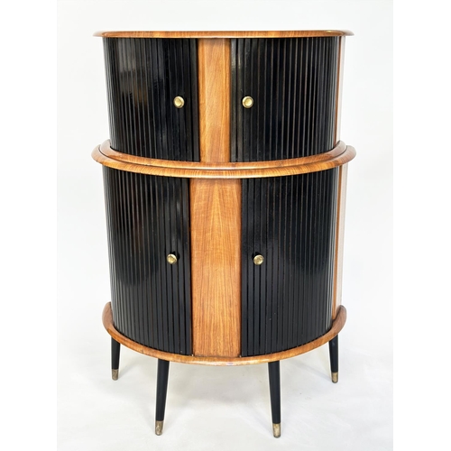 194 - COCKTAIL CABINET, 1960's demi lune walnut with double tambour sliding doors, shelved and glazed inte... 