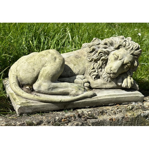 217 - GARDEN LIONS, a pair, well weathered reconstituted stone recumbent, 21cm H x 42cm W x 22cm D. (2)