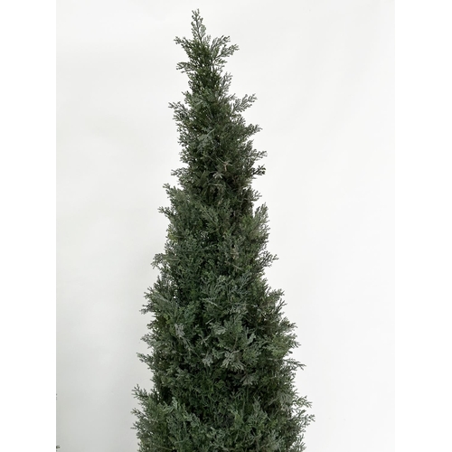 216 - ARTIFICIAL CONIFERS, a pair, in silvered metal drum planters, planters 49cm W, heights overall appro... 