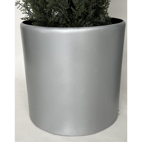 216 - ARTIFICIAL CONIFERS, a pair, in silvered metal drum planters, planters 49cm W, heights overall appro... 