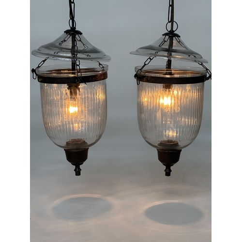 193 - BELL JAR HALL LANTERNS, a pair, glass reeded tapering and bronze style mounted, 58cm H x 34cm. (2)