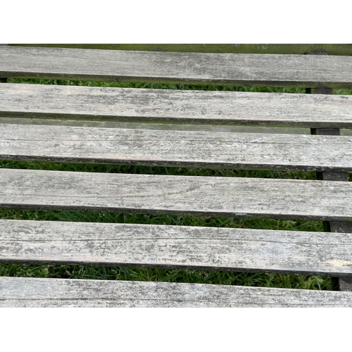 218 - LUTYENS STYLE GARDEN BENCH, weathered teak slatted after a design by Sir Edwin Lutyens, 160cm W.