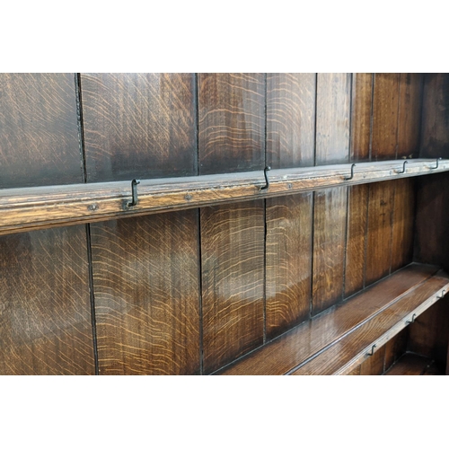 176 - DRESSER, Georgian design oak the plate rack over six drawers and two cupboard doors with square colu... 