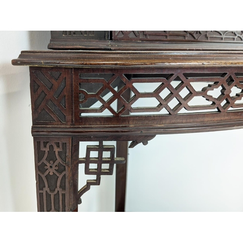 168 - GLAZED CORNER CABINET ON STAND, Edwardian mahogany in Chippendale style with door and carved fretwor... 