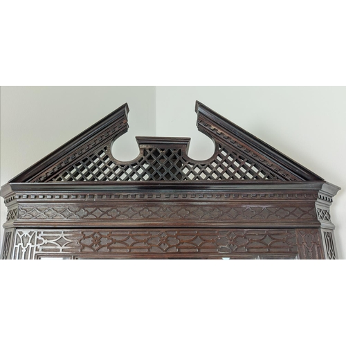 168 - GLAZED CORNER CABINET ON STAND, Edwardian mahogany in Chippendale style with door and carved fretwor... 