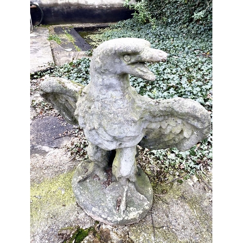 160 - GARDEN STATUE OF AN EAGLE, reconstituted stone in a weathered finish, 81cm H x 75cm W x 46cm D.