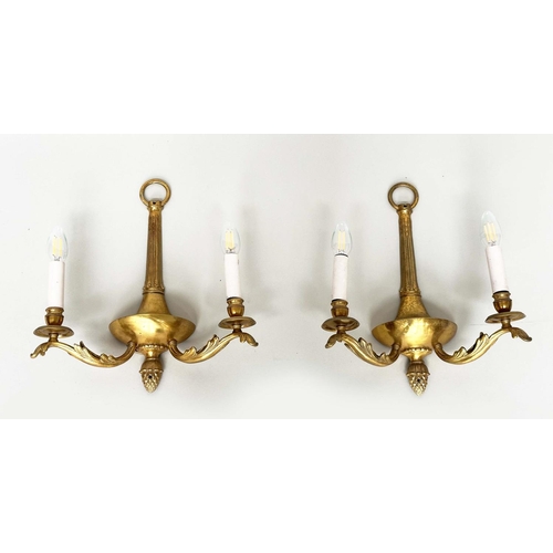 129 - WALL SCONCES, a pair, 20th century gilt metal twin arm with pineapple finials, 40cm H. (2)