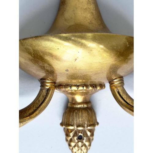 129 - WALL SCONCES, a pair, 20th century gilt metal twin arm with pineapple finials, 40cm H. (2)