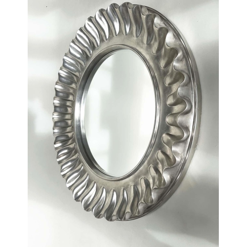 255 - WALL MIRROR, large circular wavy silvered frame, 112cm W.