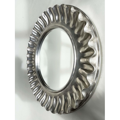 255 - WALL MIRROR, large circular wavy silvered frame, 112cm W.
