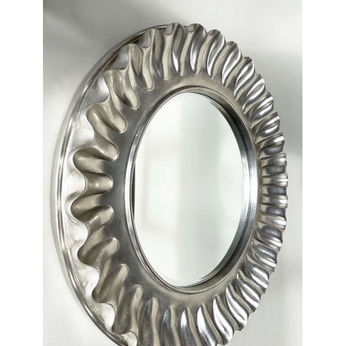 255 - WALL MIRROR, large circular wavy silvered frame, 112cm W.