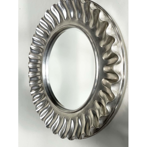 255 - WALL MIRROR, large circular wavy silvered frame, 112cm W.