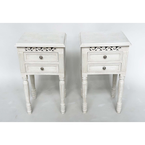 191 - BEDSIDE CHESTS, a pair, French style traditionally grey painted each with two drawers, pierced friez... 