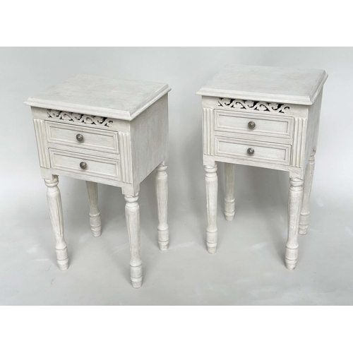 191 - BEDSIDE CHESTS, a pair, French style traditionally grey painted each with two drawers, pierced friez... 