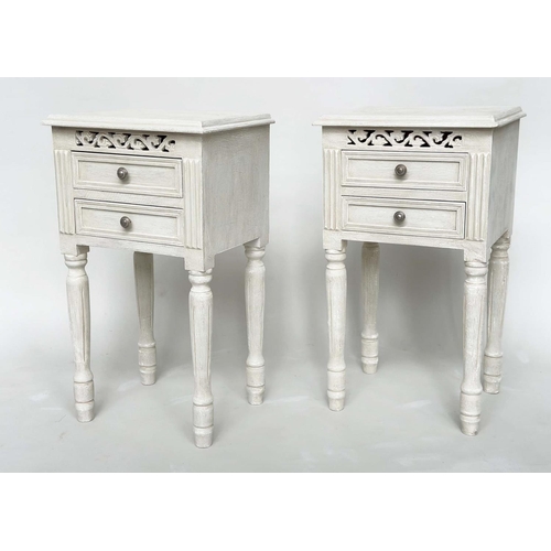 191 - BEDSIDE CHESTS, a pair, French style traditionally grey painted each with two drawers, pierced friez... 