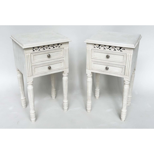 191 - BEDSIDE CHESTS, a pair, French style traditionally grey painted each with two drawers, pierced friez... 