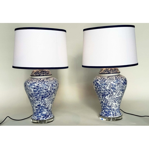 221 - TABLE LAMPS, a pair, Chinese fern blue and white ceramic of lidded vase form with lucite bases and s... 