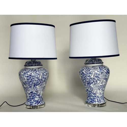 221 - TABLE LAMPS, a pair, Chinese fern blue and white ceramic of lidded vase form with lucite bases and s... 