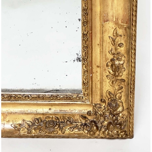 109 - WALL MIRROR, 19th century French Napoleon III giltwood and gesso moulded, arched with foliate corner... 