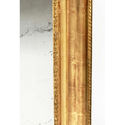 109 - WALL MIRROR, 19th century French Napoleon III giltwood and gesso moulded, arched with foliate corner... 