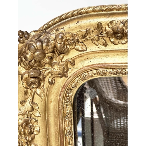 109 - WALL MIRROR, 19th century French Napoleon III giltwood and gesso moulded, arched with foliate corner... 