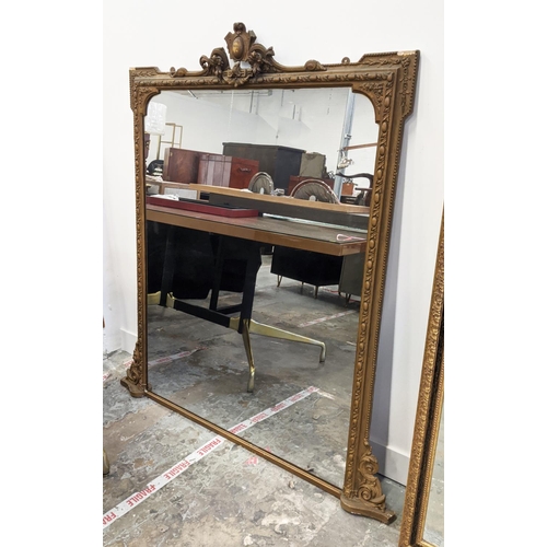 246 - OVERMANTEL MIRROR, late Victorian with a decorative gilt frame, 103cm W x 145cm H.