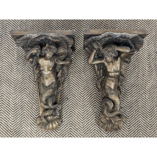 247 - WALL BRACKETS, a pair, plaster with gilt finish, depicting a mermaid and merman, each 57cm H x 52cm.... 