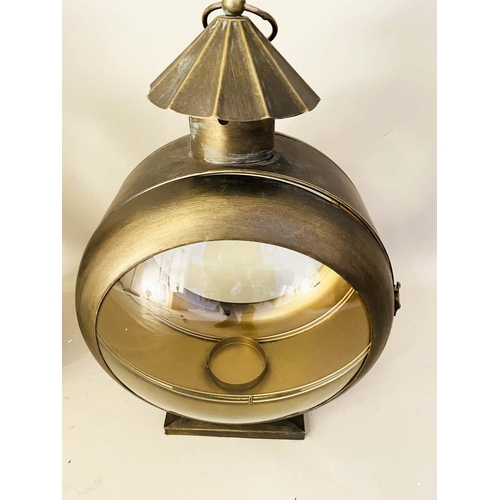 357 - CANDLE LANTERNS, a pair, in gilt metal, glazed, 56cm H x 36cm W x 26cm D (2)