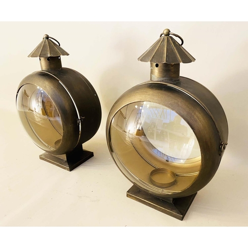 357 - CANDLE LANTERNS, a pair, in gilt metal, glazed, 56cm H x 36cm W x 26cm D (2)