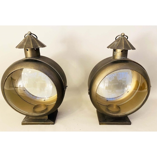 357 - CANDLE LANTERNS, a pair, in gilt metal, glazed, 56cm H x 36cm W x 26cm D (2)