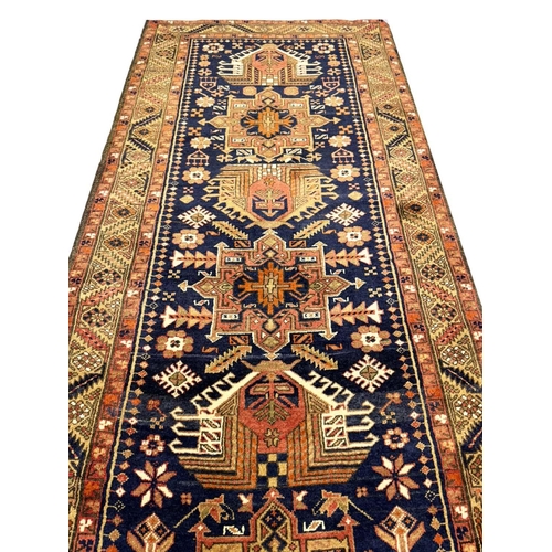 95 - PERSIAN HERIZ LONG RUNNER, 448cm x 85cm.