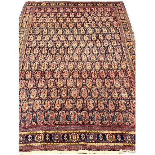 99 - ANTIQUE PERSIAN PAISLEY DESIGN RUG, 210cm x 137cm.