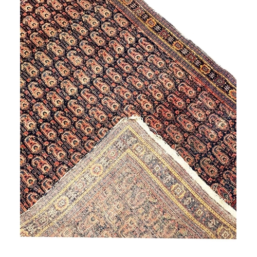 99 - ANTIQUE PERSIAN PAISLEY DESIGN RUG, 210cm x 137cm.