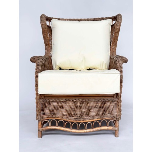 134 - CONSERVATORY ARMCHAIR, mid 20th century rattan framed and cane woven with shaped back and cushions, ... 