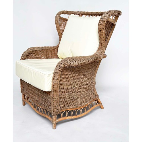 134 - CONSERVATORY ARMCHAIR, mid 20th century rattan framed and cane woven with shaped back and cushions, ... 