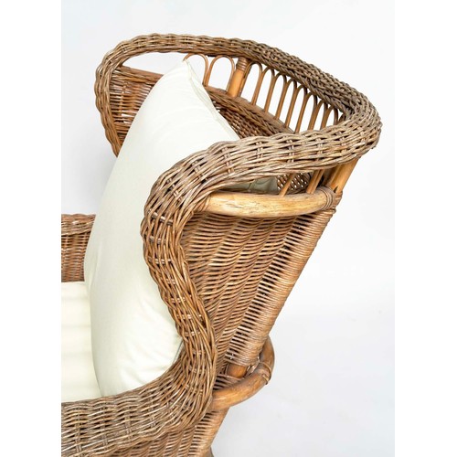 134 - CONSERVATORY ARMCHAIR, mid 20th century rattan framed and cane woven with shaped back and cushions, ... 