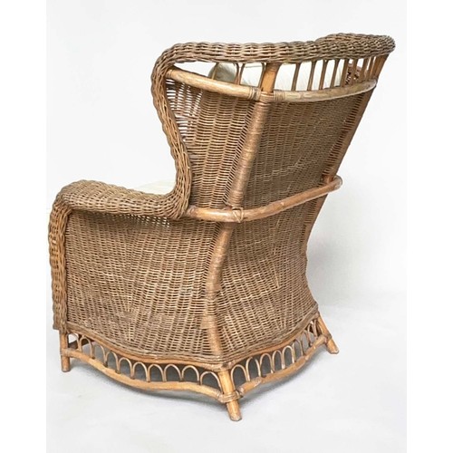 134 - CONSERVATORY ARMCHAIR, mid 20th century rattan framed and cane woven with shaped back and cushions, ... 