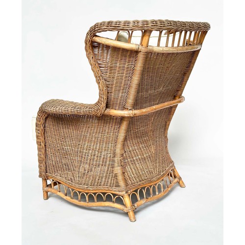 134 - CONSERVATORY ARMCHAIR, mid 20th century rattan framed and cane woven with shaped back and cushions, ... 