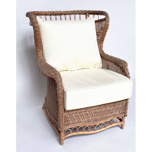 134 - CONSERVATORY ARMCHAIR, mid 20th century rattan framed and cane woven with shaped back and cushions, ... 