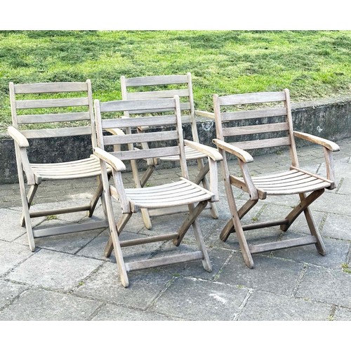 137 - GARDEN ARMCHAIRS BY ALEXANDER ROSE, a set of four, nicely weathered teak each folding with arms, Sus... 