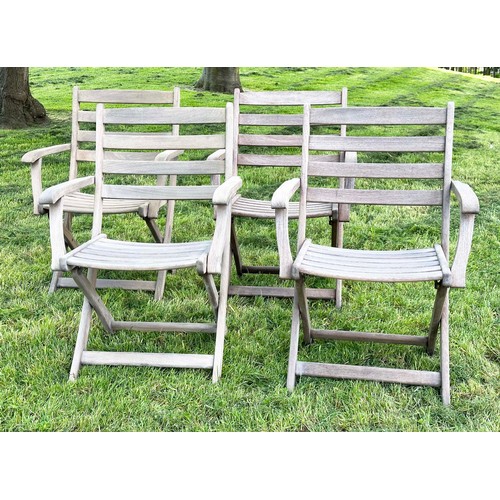 137 - GARDEN ARMCHAIRS BY ALEXANDER ROSE, a set of four, nicely weathered teak each folding with arms, Sus... 