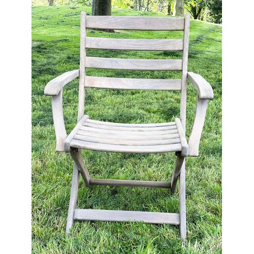 137 - GARDEN ARMCHAIRS BY ALEXANDER ROSE, a set of four, nicely weathered teak each folding with arms, Sus... 