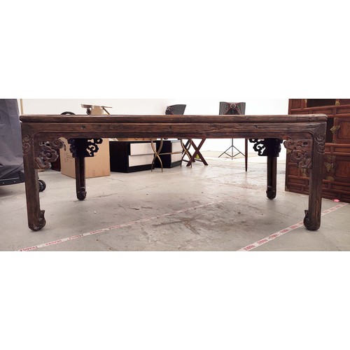 184 - DINING TABLE, Chinese elm with carved legs and pierced spandrels, 217cm L x 107cm W x 88cm H.