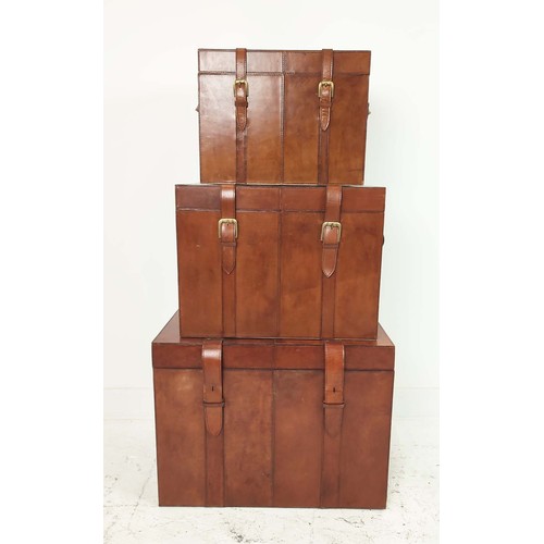 408 - TRUNKS, a graduated set of three, each with buckle closing lids, 61cm x 46cm x 46cm at largest. (3)