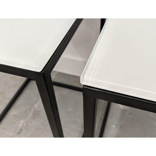 426 - SIDE TABLES, a pair, 40cm x 40cm x 55cm, frosted glass tops, on black painted metal supports. (2)