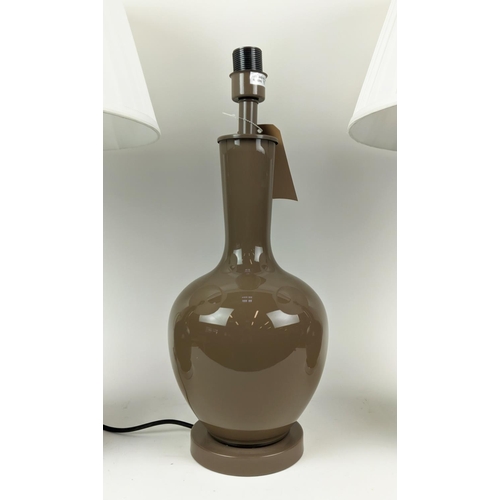 457 - OKA TABLE LAMPS, a pair, 71cm H with one other. (3)