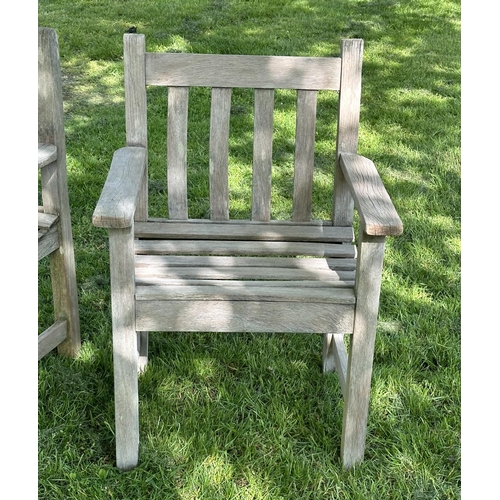 132 - GARDEN ARMCHAIRS, a pair, silvery weathered teak and slatted with flat top arms, 86cm H x 50cm W x 5... 