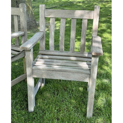 132 - GARDEN ARMCHAIRS, a pair, silvery weathered teak and slatted with flat top arms, 86cm H x 50cm W x 5... 