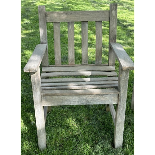 132 - GARDEN ARMCHAIRS, a pair, silvery weathered teak and slatted with flat top arms, 86cm H x 50cm W x 5... 