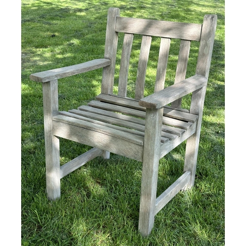 132 - GARDEN ARMCHAIRS, a pair, silvery weathered teak and slatted with flat top arms, 86cm H x 50cm W x 5... 